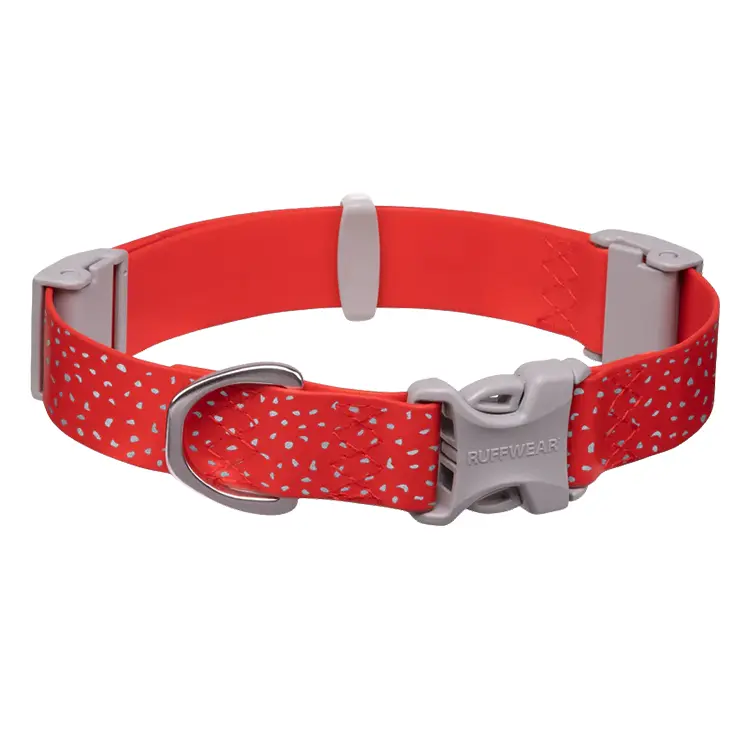A vibrant red RUFFWEAR Dog Waterproof Collar with white speckles and a gray plastic buckle features a metal D-ring for leash attachment. Laid flat, it showcases an adjustable design.