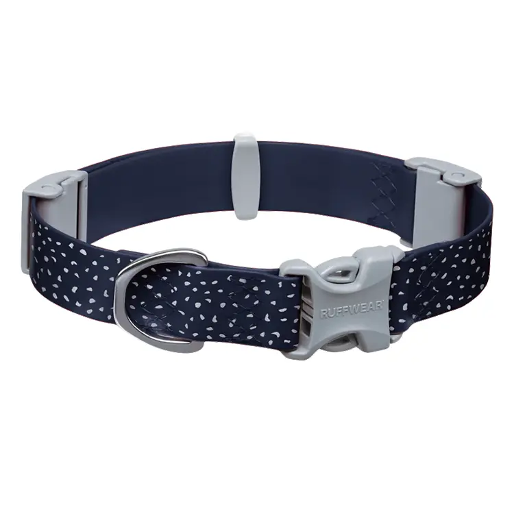 A blue RUFFWEAR Dog Waterproof Collar with white speckles and a gray plastic buckle features a metal D-ring for leash attachment. Laid flat, it showcases an adjustable design.