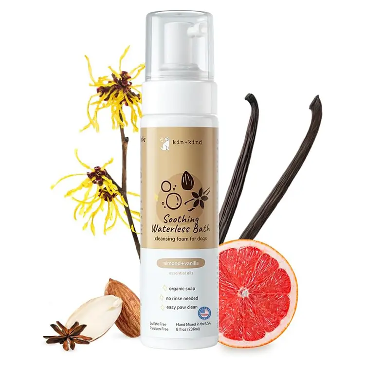 A bottle of Waterless Dry Shampoo for Dogs, labeled as a rinse-free cleansing foam designed to eliminate itch and odor. The product features a natural formula with essential oils and organic soap, free from sulfur and parabens. The bottle contains 8 fl oz (236ml) of the shampoo, which is hand-mixed in the USA. The packaging highlights its soothing properties and easy paw clean application