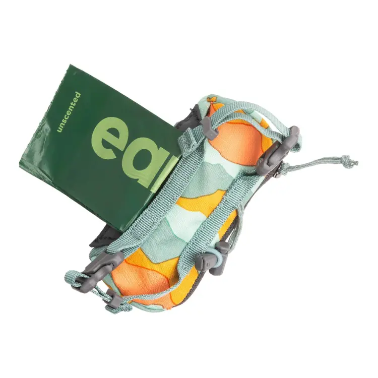 Compact dog poop bag holder with waste bags loaded inside, designed for easy dispensing during walks or hikes.